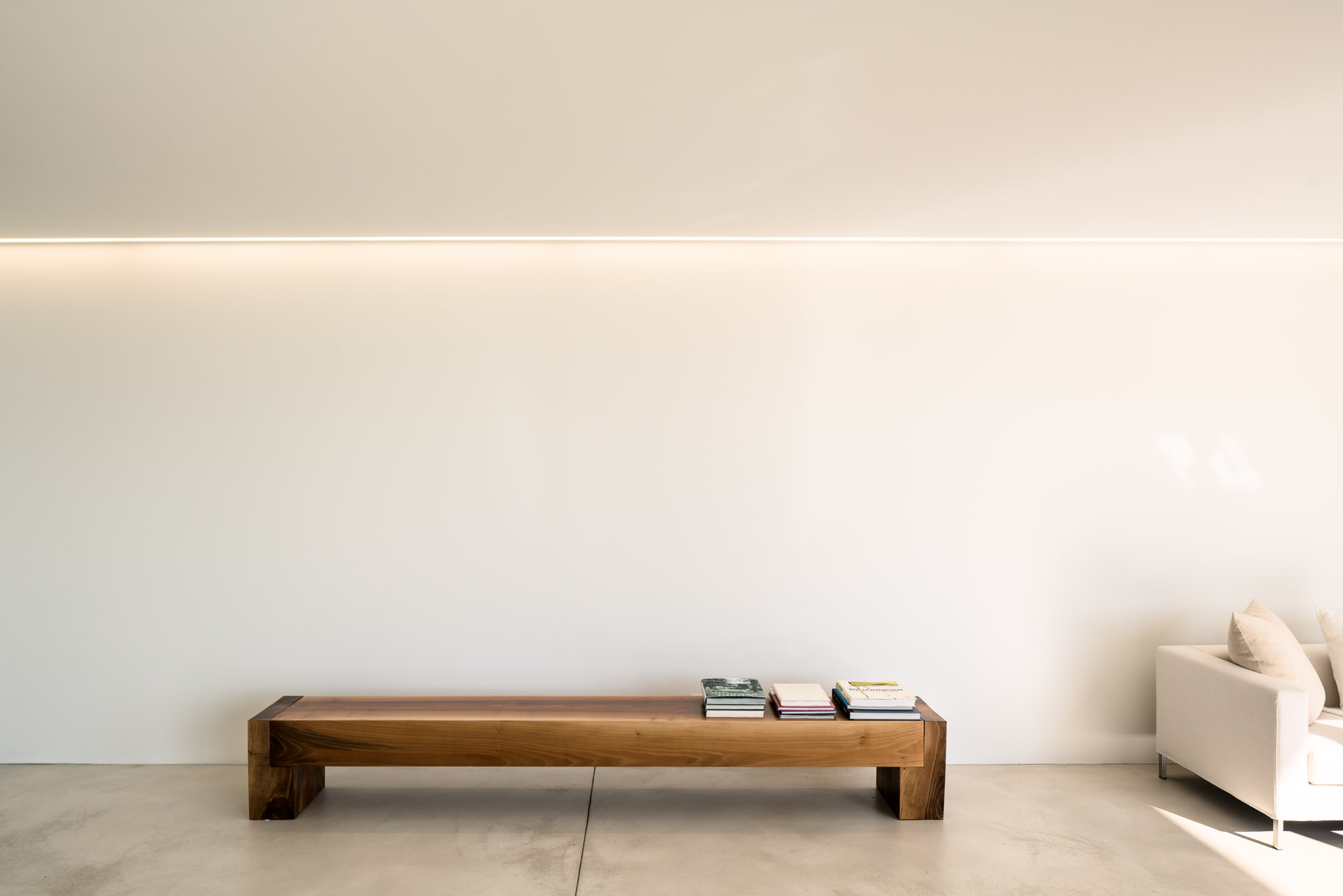 Interior Design Photography - braun wooden bench and books